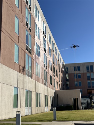 Drone-assisted exterior cleaning for large commercial buildings and hard-to-reach surfaces.
