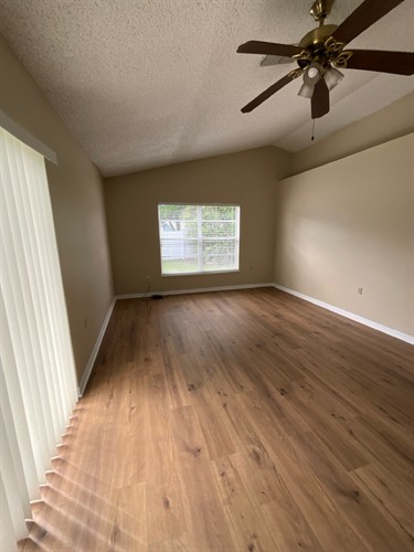 Painting and Carpet-to-Laminate Flooring Installation (After)