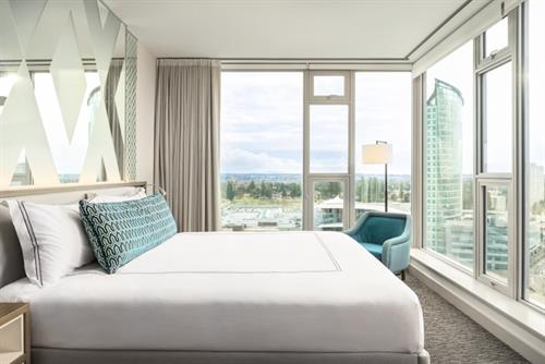 Guest room - king bed on corner with panoramic views of the city Guest room - king bed on corner with panoramic views of the city