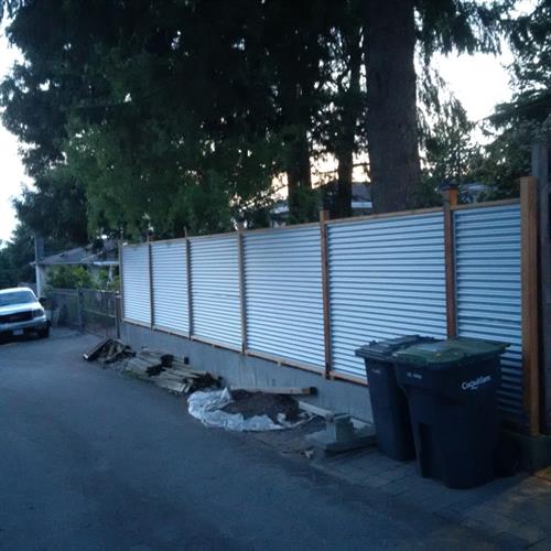 Our Cladding looks sleek and has long lasting durability like this SM7/8 Corrugated used in this homeowners fence