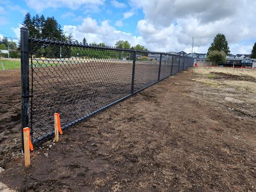 Welded construction black chain link fence.