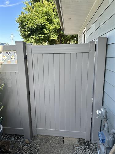 Custom white lattice and gray solid vinyl fence for a homeowner. Custom white lattice and gray solid vinyl fence for a homeowner.