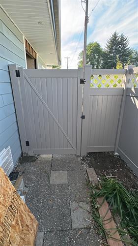 Custom white lattice and gray solid vinyl fence for a homeowner. Custom white lattice and gray solid vinyl fence for a homeowner.