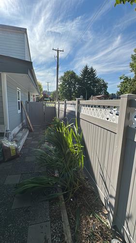 Custom white lattice and gray solid vinyl fence for a homeowner. Custom white lattice and gray solid vinyl fence for a homeowner.