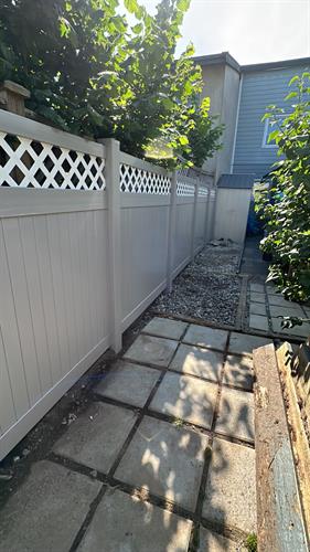 Custom white lattice and gray solid vinyl fence for a homeowner. Custom white lattice and gray solid vinyl fence for a homeowner.