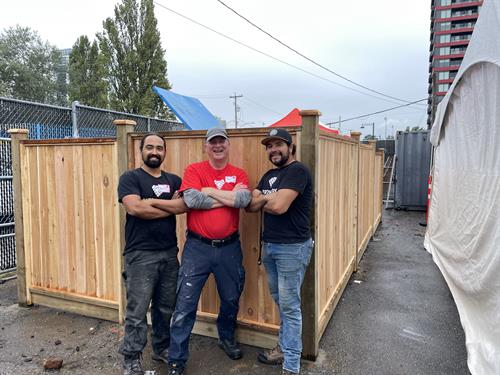 Solid cedar wood fence at a charitable organization in Surrey.