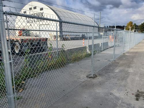 Industrial chain link fence with barbwires. Industrial chain link fence with barbwires.