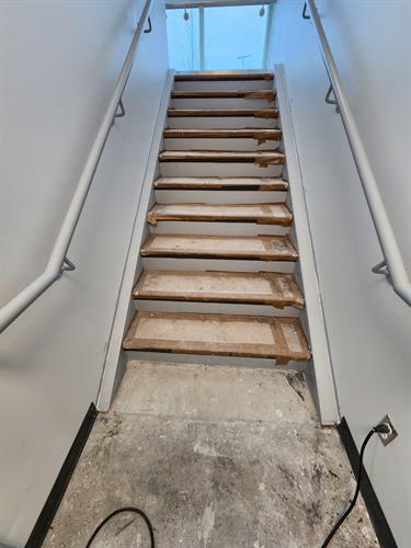 Welded flatbar for stairs at Centennial Secondary School, Coquitlam.