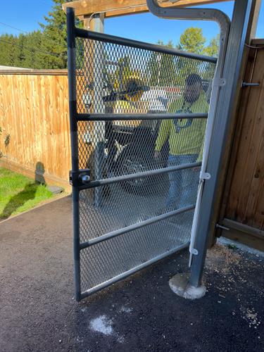 Custom fabricated steel gate at a local charitable organization. Custom fabricated steel gate at a local charitable organization.