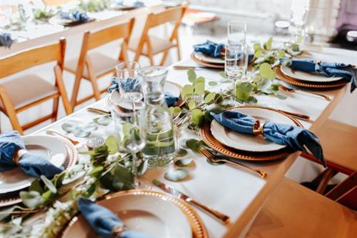 Natural wood folding chairs with blue & gold accents