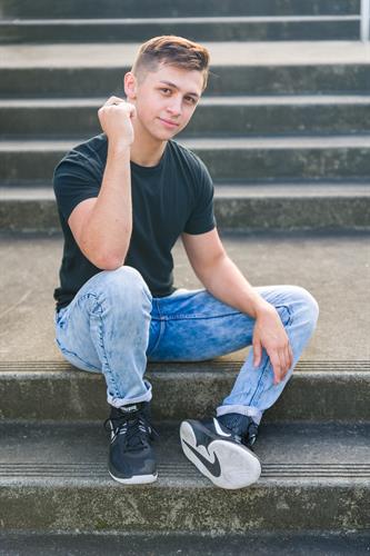 High School Senior photos of a young man on location in downtown Edmonds
