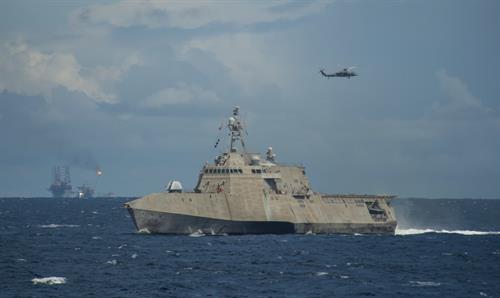 Gallery Image 191029-Navy-LCS_8_transits_while_an_MH-60S_Sea_Hawk_flies_overhead_during_CARAT_Brunei.jpg
