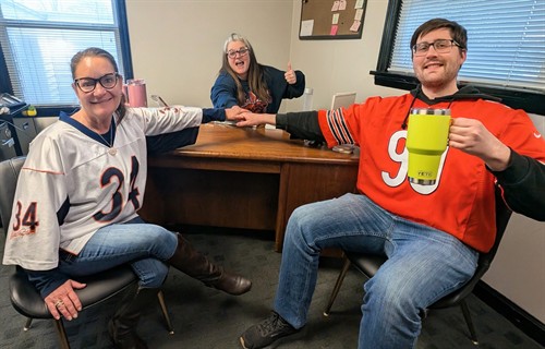 Erika, Stacy, and Matt supporting the Bears in the Playoffs second round 2026