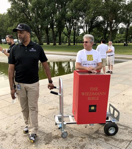 Gettin ready to unfold the Wiedmann Bible around the Lincoln Memorial Reflecting Pool in Washington, DC