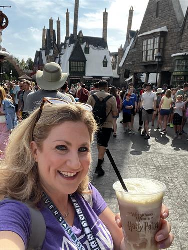 Enjoying a frozen butterbeer at the Wizarding World of Harry Potter, Universal Orlando.