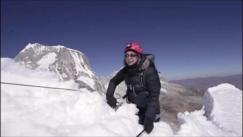 Reaching the summit of Ishinca Mountain, Peru