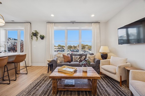 Each sunny suite is impeccably appointed with modern furnishings, luxe linens, full kitchens, in-unit laundry and inviting living rooms with cable television.