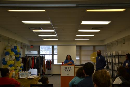 Supriya M. addressing the community at the Essential Needs Center