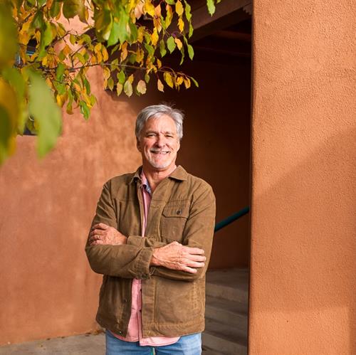 John Cornish outside the Berkshire Hathaway HomeServices Taos office, where he helps buyers and sellers navigate the Taos real estate market with clarity and local insight.