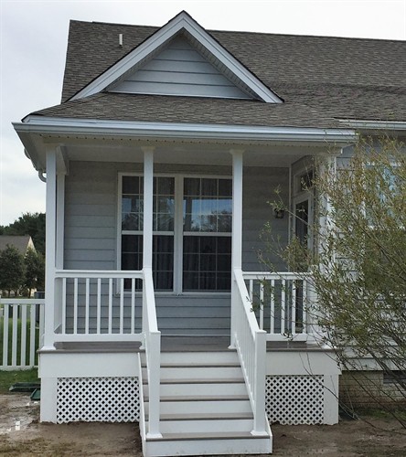 This new front porch adds charm to this cute home!