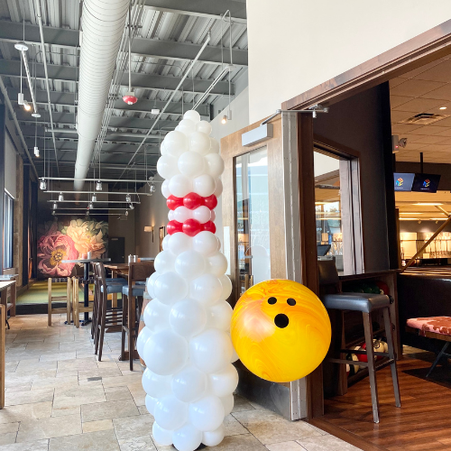 A Balloon Bowling Pin & Ball for a Birthday Party at Pinstripes Pinecrest