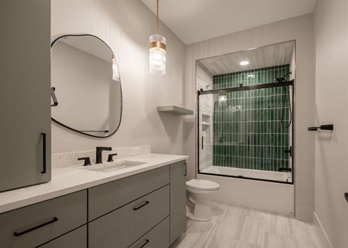 Child's Bathroom of Contemporary Haven Custom Home by Otero Signature Homes 2023