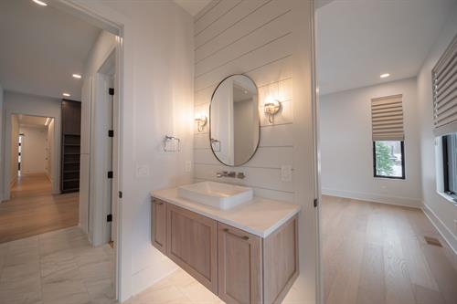 Guest Bathroom of Contemporary Haven Custom Home by Otero Signature Homes 2023