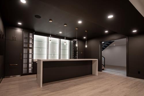 Basement Bar of Contemporary Haven Custom Home by Otero Signature Homes 2023