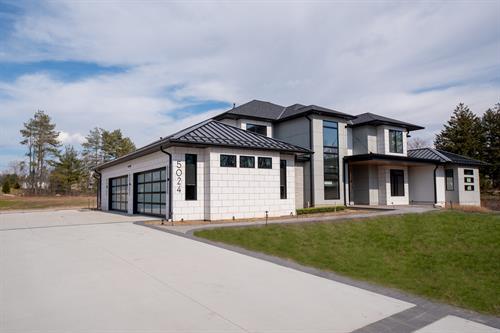 Exterior of Contemporary Haven Custom Home by Otero Signature Homes 2023