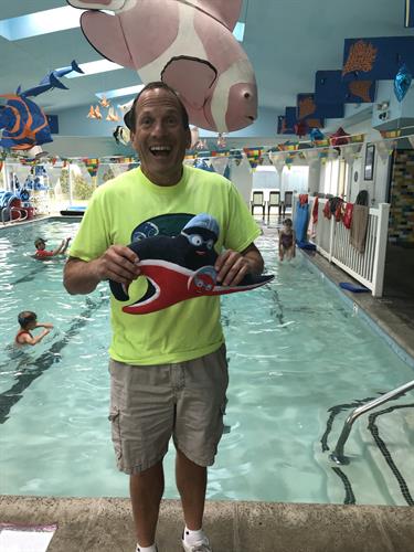 Owner Jeff Purchin with the United States Swim School Associations mascot "Pete and Repeat"