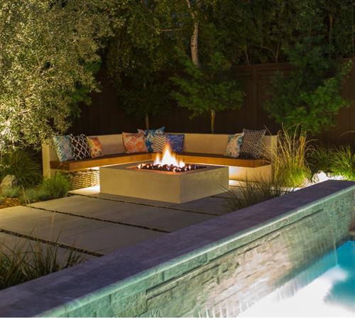 Cozy, custom built-in seatwall and fire-pit area to enjoy with family and friends