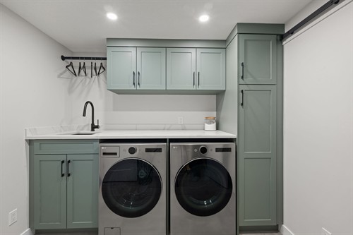 Custom Basement Development  in Lacombe Park, St Albert. This is the custom laundry room.