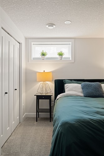 A nice bedroom in a basement we finished in St Albert