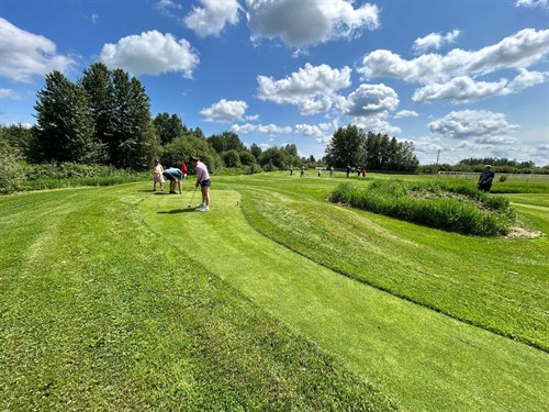 Undulating bent grass greens for all ages to walk and play together