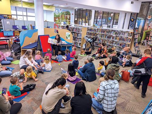 Storytime inside the refreshed Children's area at the Downtown Library in 2023
