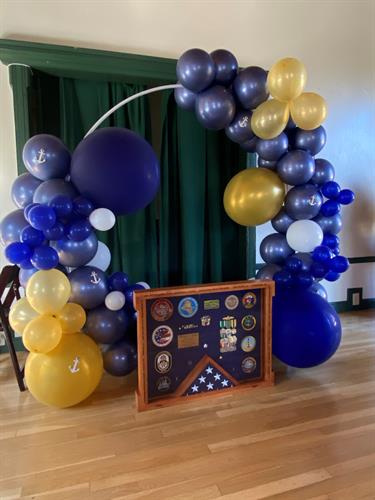 Navy Retirement Balloon Arch created using Party Over Here balloons, 5", 11" and 36" matte and metallic finish balloons.