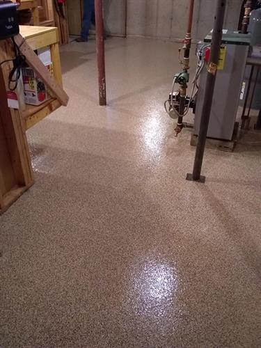 This utility room/workshop floor was upgraded to a beautiful looking epoxy flake system that prevents dust, and is easy to clean