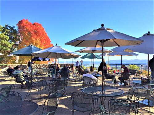 Diners enjoy lunch on the terrace in autumn