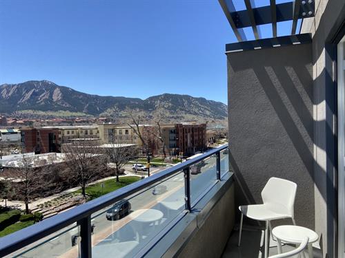 Upgraded suites include balconies and views of the Flatiron Mountains