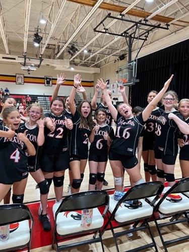 Middle School volleyball players celebrate a great game! 