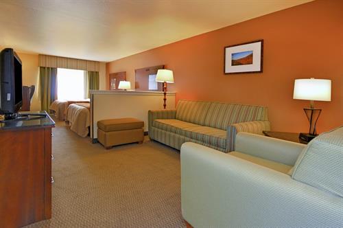 Suite room with seperate sitting area and 2 televisions