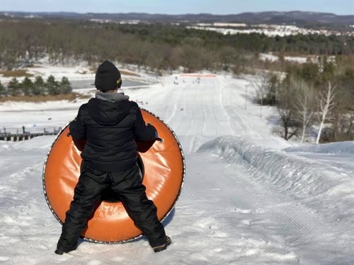 Gallery Image BoywithOrangetubTOPofhill.jpg