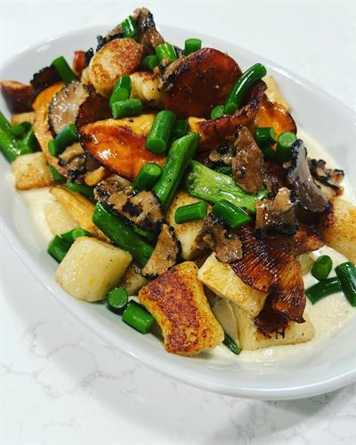 Potato Gnocchi- Olive Oil Cured Black Truffle, Dragon Tongue Beans, Garlic Scapes, Foraged Chanterelle and Lobster Mushroom, and Sartori Parmesan Cream Sauce.  Private Chef Dinner