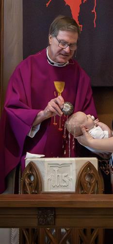 Holy Baptism at the font—capturing the sacramental life of LCMS congregations through professional church photography.”