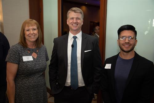 Erik Delgadillo, Director of Growth, along side Ailene Dewar and Christopher Schwarz at the yearly Economic Forecast.