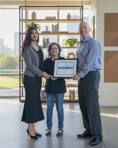 Presentation of GICC membership certificate by Ambassador Joe Alvarez to Shanthi and Tuljai Parkar.