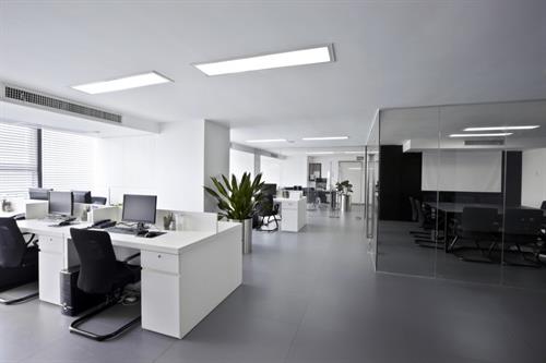 Routine commercial office cleaning including dusting, disinfecting work areas, vacuuming, trash removal, and maintaining clean, professional workspaces.
