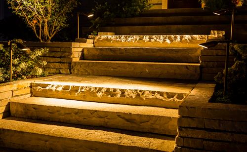 Soft lights on solid ledgestone steps interspersed with landings provide a much friendlier and safer alternative to the steep steps we replaced. Soft lights on solid ledgestone steps interspersed with landings provide a much friendlier and safer alternative to the steep steps we replaced.