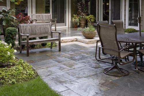 Natural bluestone is a perfect choice for this seen-from-every-room patio. Natural bluestone is a perfect choice for this seen-from-every-room patio.