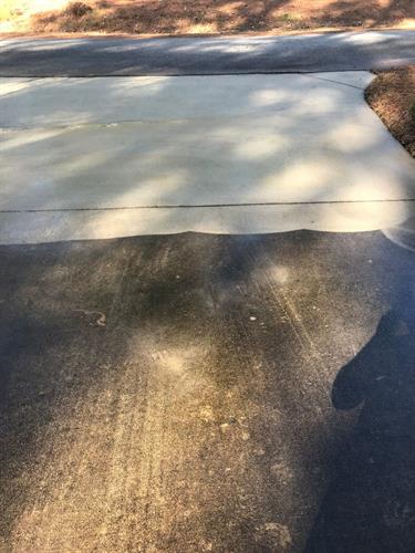 Driveway pressure wash in process (before and after)